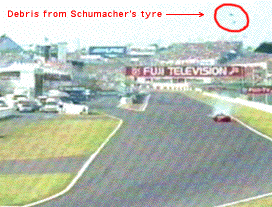 Schumacher's tyre goes into parts
